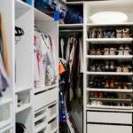 a walk in closet filled with lots of shoes